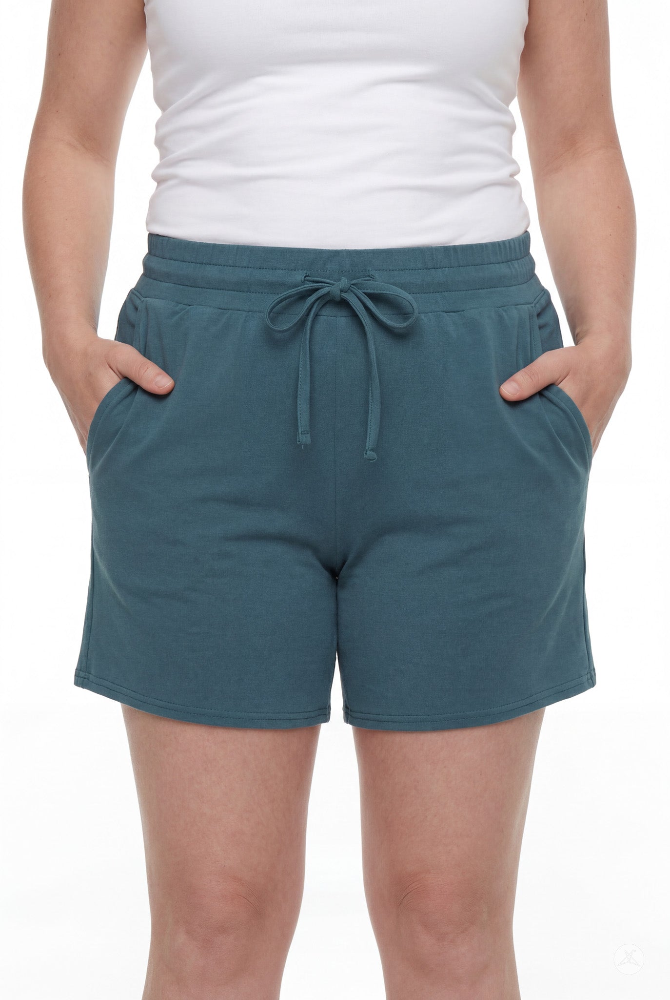 Person wearing teal Lounge Shorts by SweetLegs with drawstring waist and pockets, standing with hands in pockets