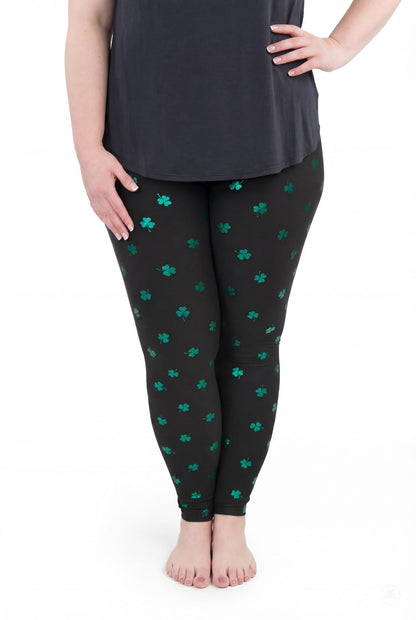 Lucky Glow leggings by SweetLegs featuring emerald shamrock foil print on dark fabric for a subtle sparkle effect