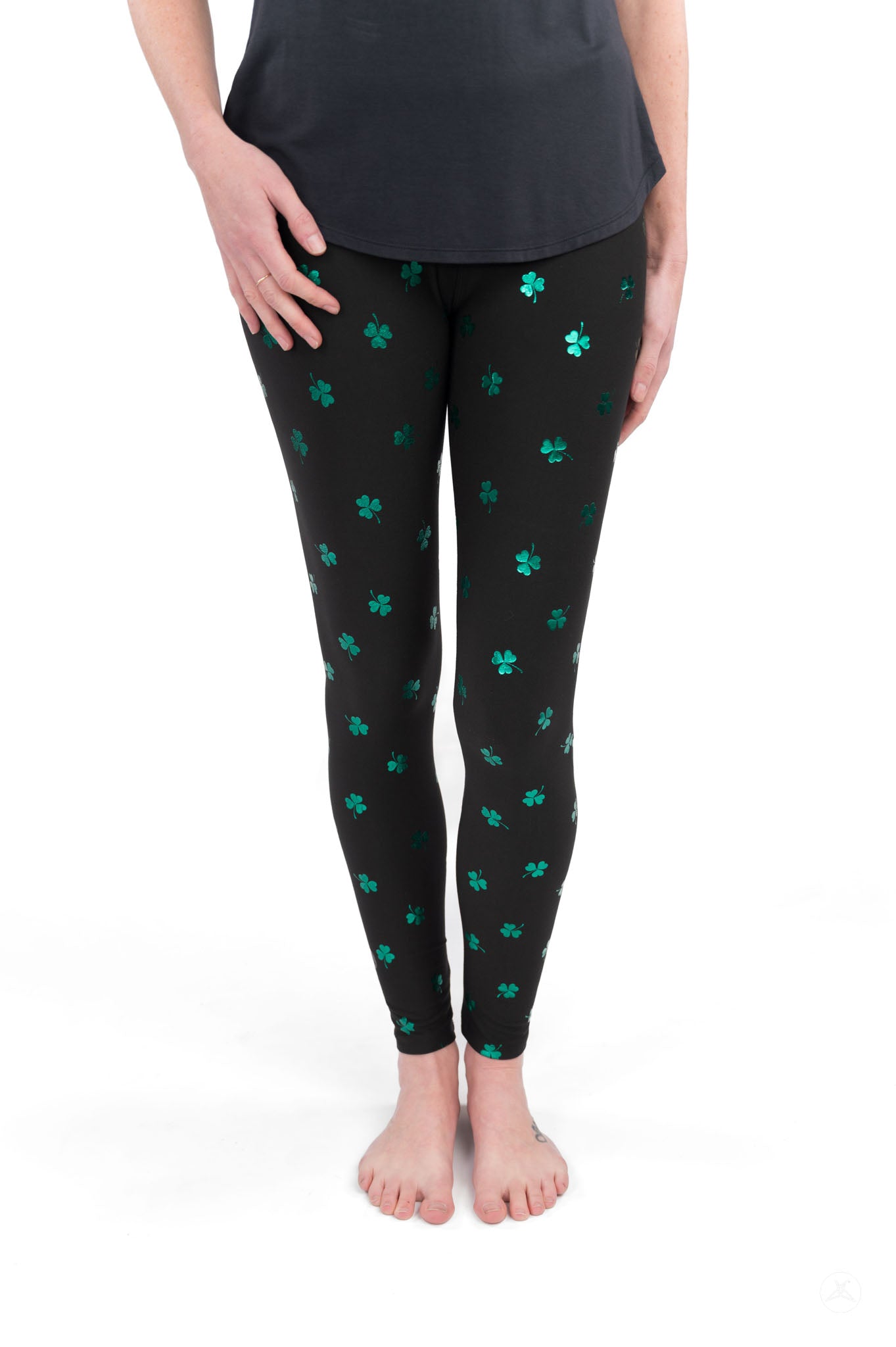 Lucky Glow leggings by SweetLegs with scattered emerald shamrocks on black, adding sparkle and style to any outfit