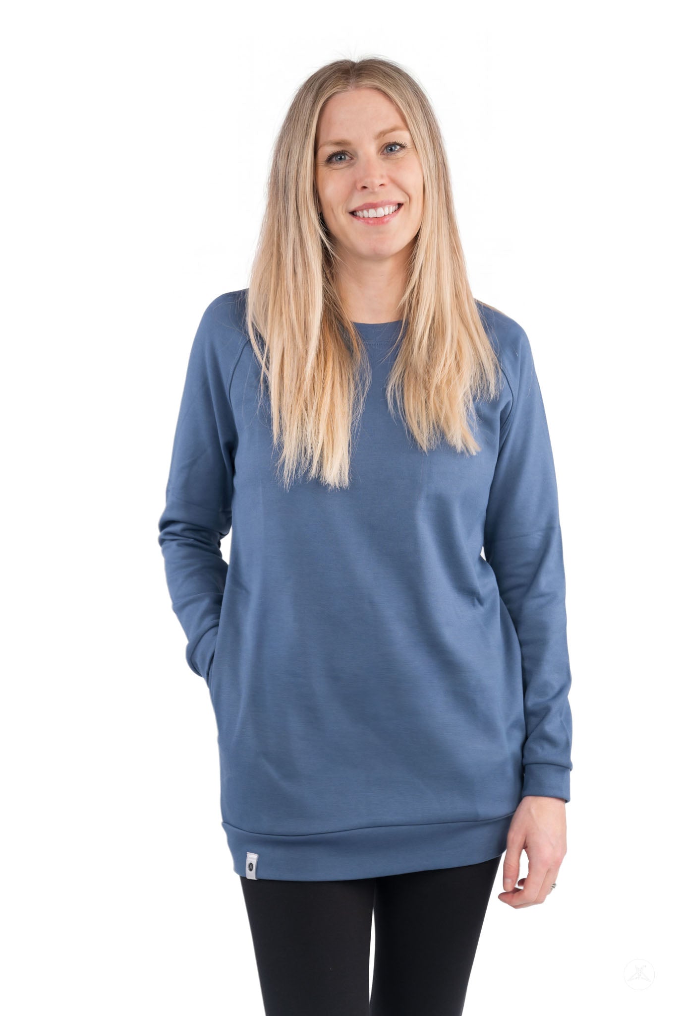 Woman wearing a blue Basic Raglan Pullover (Copy) by SweetLegs Canada standing and smiling against white background