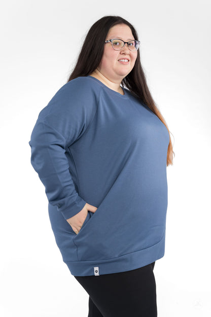 Plus size model wearing Basic Raglan Pullover (Copy) by SweetLegs Canada in blue with pockets and relaxed fit