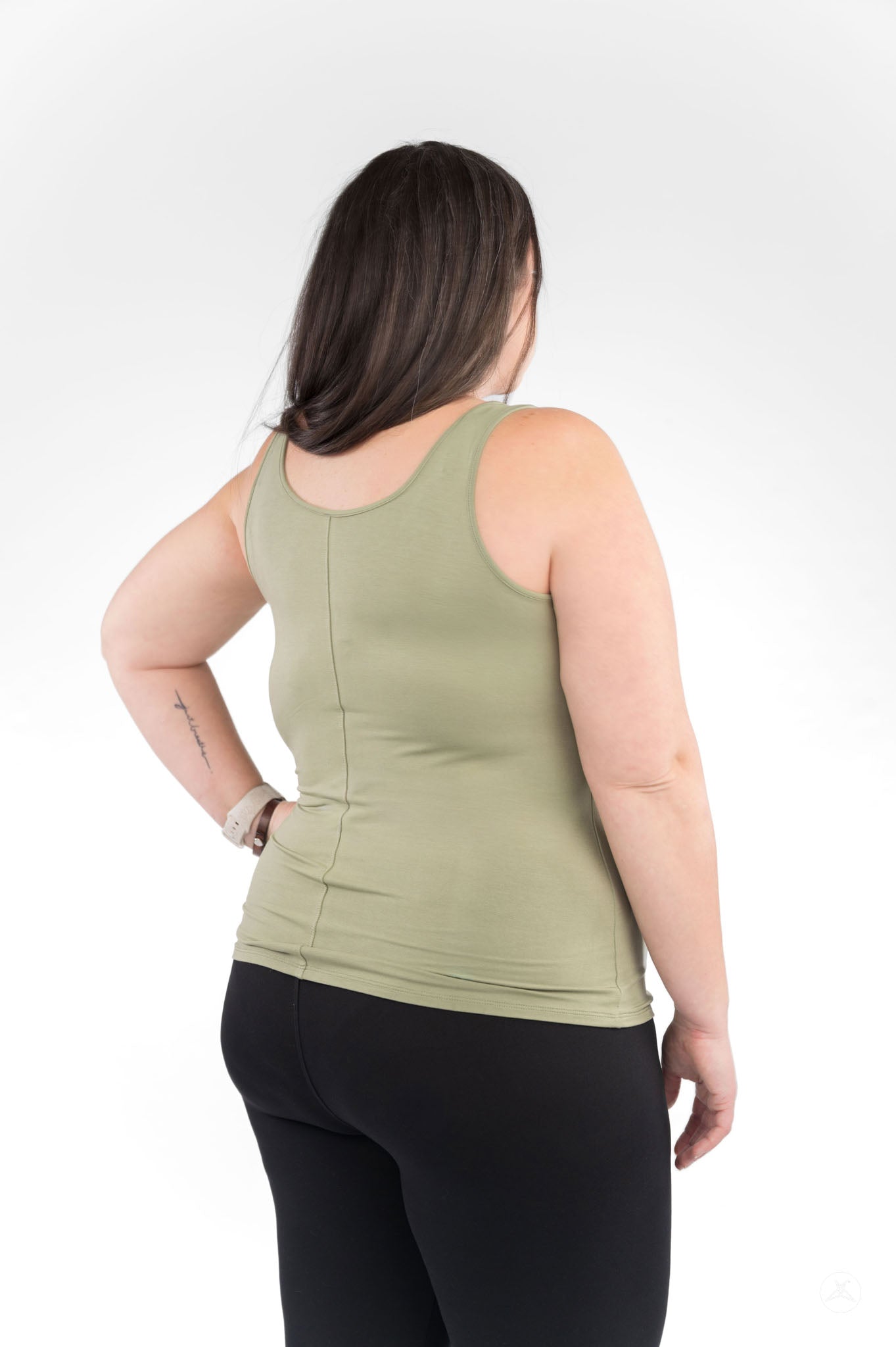 Woman wearing olive Classic Tank (Copy) from SweetLegs Canada shown from back with black leggings