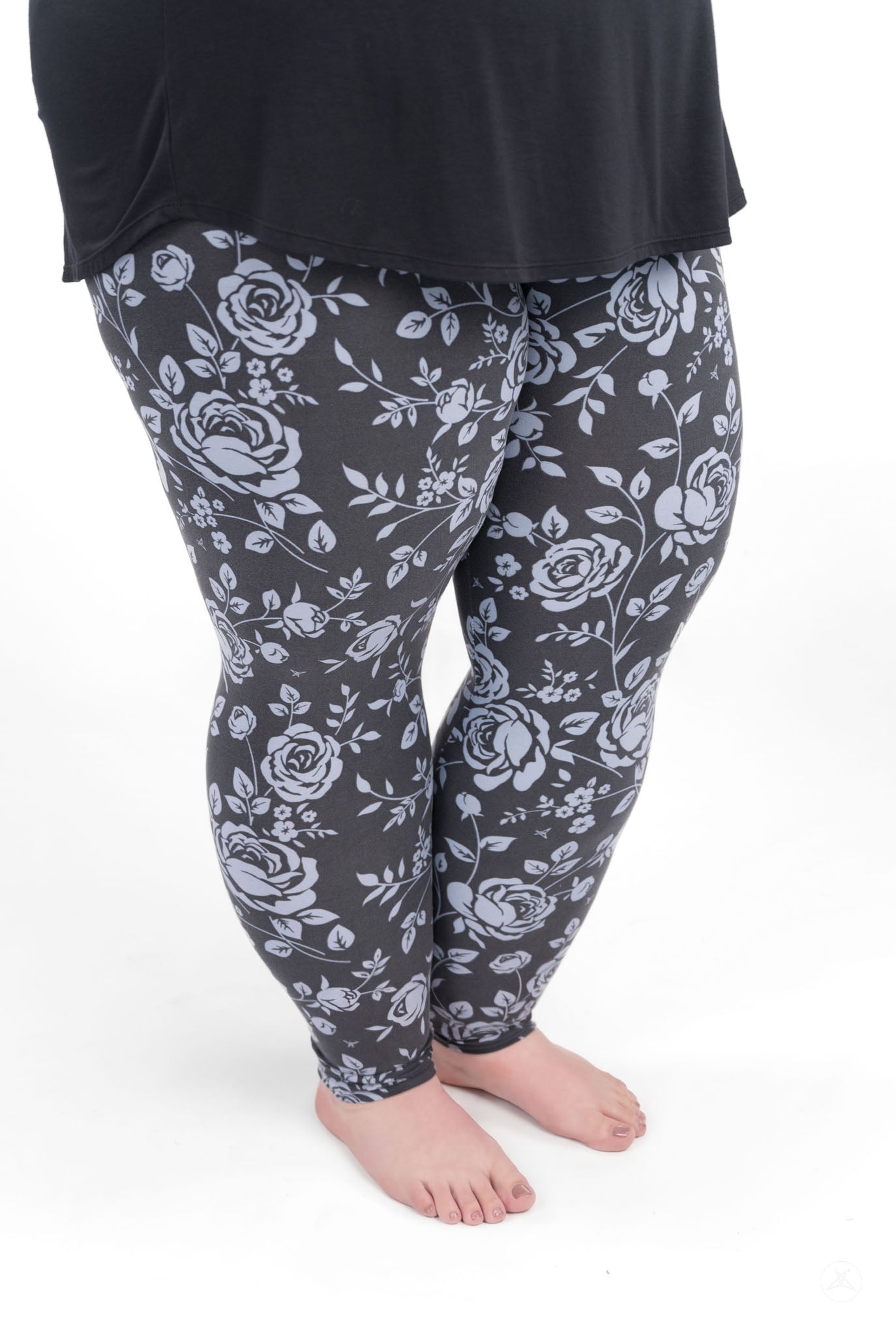 SweetLegs Shadow Garden leggings featuring soft grey-blue floral print on a dark background with a flattering fit.