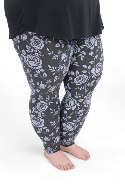 SweetLegs Shadow Garden leggings featuring soft grey-blue floral print on a dark background with a flattering fit.