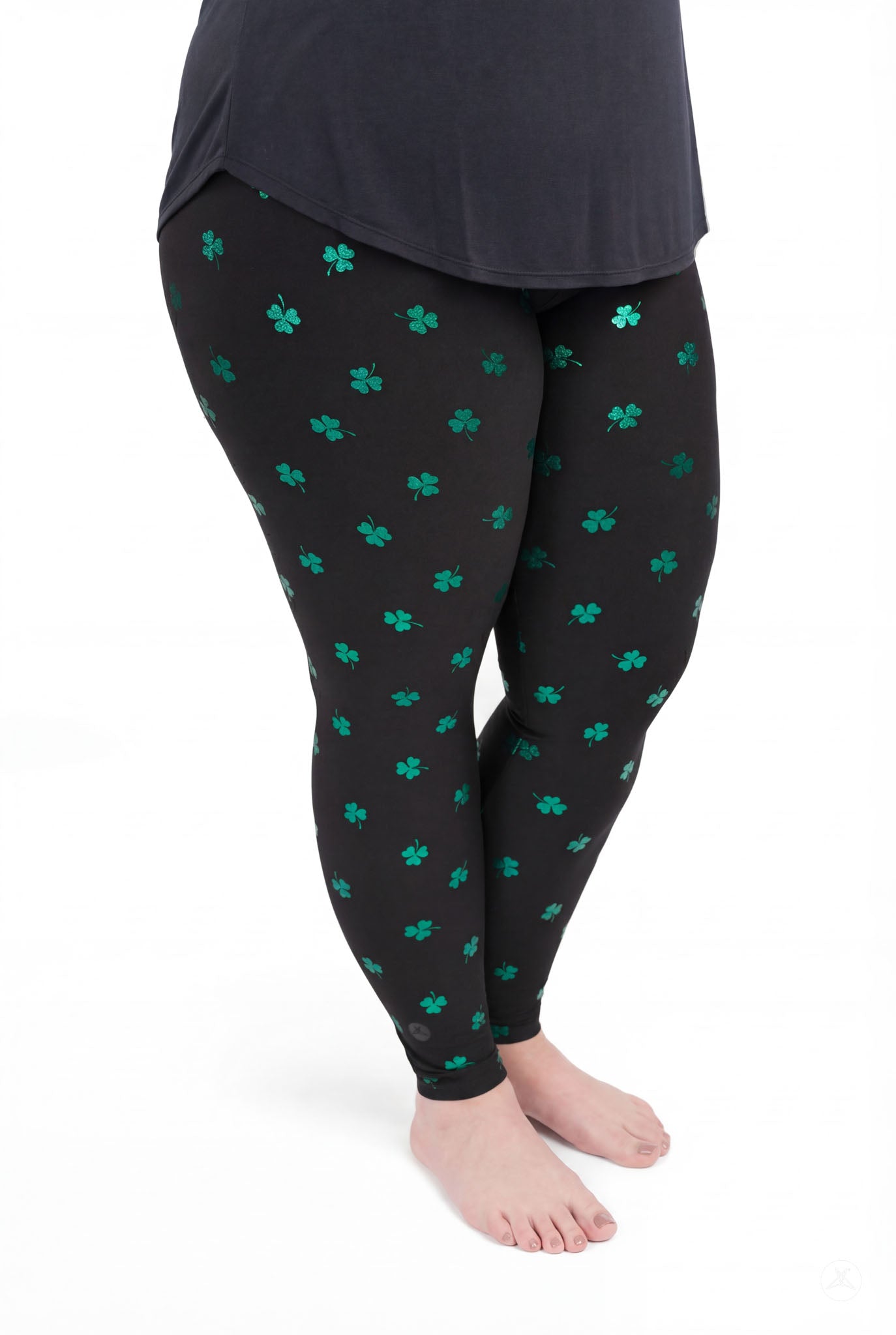 Lucky Glow leggings by SweetLegs featuring emerald foil shamrock print on a black moody background